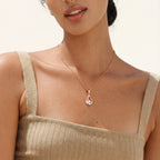 Teardrop pendant necklace worn on the neck