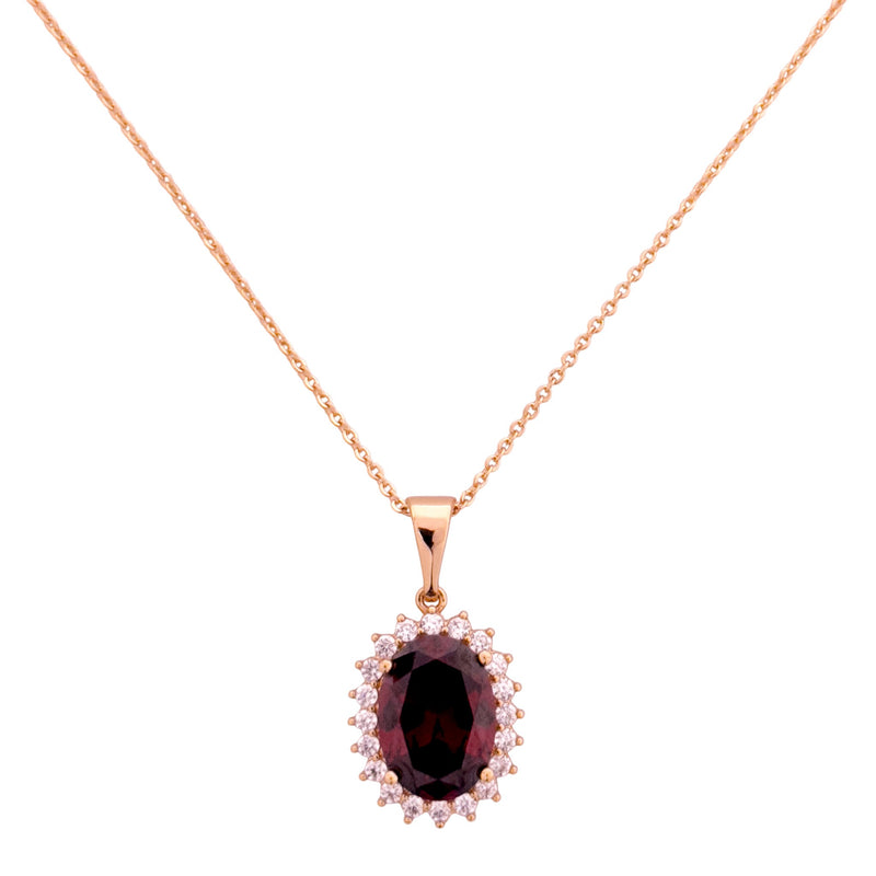 18k gold necklace with an oval red stone pendant and pavé halo on a white background