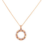 Gold necklace with a circular pendant on a white background