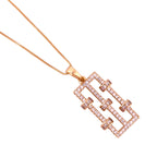 Rose gold necklace with a geometric pendant on a white background