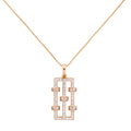 Rose gold necklace with a rectangular pendant on a white background
